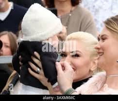Gwen Stefani, Behati Prinsloo and Dusty Rose Levine attending Adam Levine's  Hollywood Walk of Fame Ceremony Stock Photo