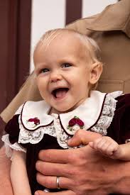 I love this photo of me and my little ones, but my baby isn't smiling.  Would someone be able to put the 2nd image of him smiling