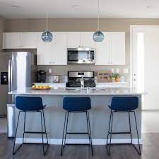 Foxy, alluring and cool are just some of the ways to describe these modern our favourite part of this glorious white space? Anco Baya Blue Counter Stool Blue Counter Stools Modern Counter Stools Modern Kitchen Room