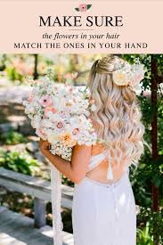 Wedding flowers for bride hair. Make Sure The Flowers In Your Hair Match The Ones In Your Hand