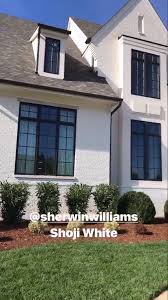 Black And White Brick Paint Sherwin Williams Shoji White Painted Brick With Bronze Windows And Gutters Brick Exterior House House Paint Exterior Painted Brick House