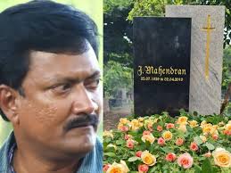 director mahendran son john mahendran visits his fathers cemetry