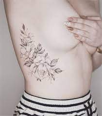 The outline of the world's map looks really cool as a rib tattoo. 25 Charming Rib Tattoos Designs To Try In 2019