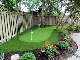Adding A Backyard Golf Hole Will Give You The Opportunity To Get Some Putting Practice In Befo Backyard Putting Green Green Backyard Backyard Landscaping Plans