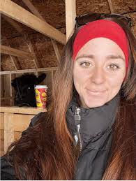 Alpacas hanging out with me while cleaning stalls