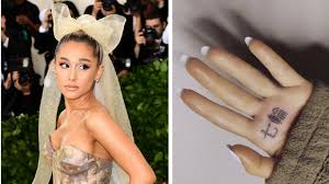 Ariana grande really got bbq grill in japanese tattooed on her hand because the proper translation for 7 rings is apparently to painful like???? Ariana Grande Laughs Off Japanese Palm Tattoo Typo Itv News