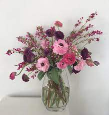 Housewarming Flower Arrangement Made With Pink And Purple Ranunculus With Boronia Heathe Purple Flower Arrangements Pink And Purple Flowers Flower Arrangements