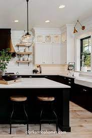 Black And White Tuxedo Cabinets Are Customized To This Spacious Modern Farmhouse Kitchen Modernfa Home Decor Kitchen Kitchen Style Home Kitchens