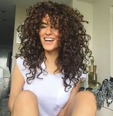 This pinned back look celebrates your curly hair and is also the perfect excuse to break out some cute hair pins or clips. Long Layered Curly Haircuts Novocom Top