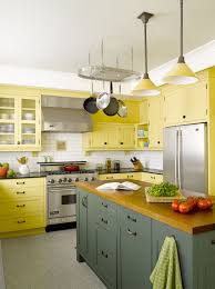 Small kitchens will appear more spacious with all white backsplashes, cabinets and countertops. All About Wood Countertops Modern Yellow Kitchen Cabinets Kitchen Colors Kitchen Interior