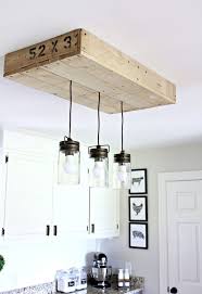 36 Farmhouse Lighting Ideas To Brighten Up Your Space In A Charming Way Diy Kitchen Lighting Diy Mason Jar Lights Farmhouse Kitchen Lighting
