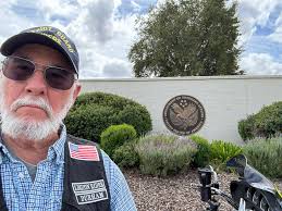 Lowering flags to half staff for a Vietnam veteran