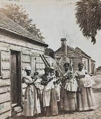 Two young girls who are free behind an opened plantation gate. Photographed  at the old Goose Creek Plantation in Charleston, South Carolina. LOC |  Facebook