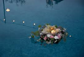 Floating candle and flower centerpieces for weddings. Floating Wedding Flowers For The Dreamiest Reception Mywedding