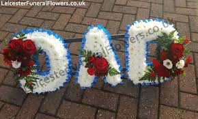 Tied sheaf of funeral flowers in classic bright red and white tones. Red White And Blue Dad Funeral Heart Wreaths