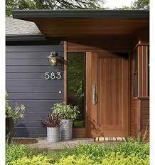 The front door and shutters are a gloss black and look very rich. Eye Candy 10 Dark Painted Exteriors Brick Exterior House House Paint Exterior Modern House Number