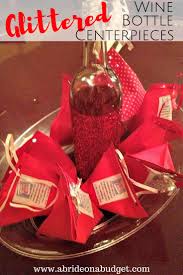 These lights added excellent talking pieces to our home and a fun way to remember fond memories. Glittered Wine Bottles Centerpieces A Bride On A Budget