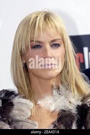 Sharon Stone poses for the photographers with 2005 winners Kelly Reilly and  Jonathan Rhys Meyers during the Chopard Trophy Party in Cannes