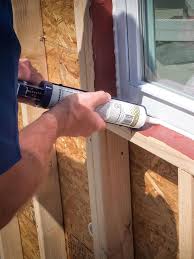 Cut the poly sheeting about 1/2 inch outside the perimeter of the windows and doors then use the sheathing tape to seal that area to the window and door jambs all the way around them. Window Door Air Sealer Prosoco R Guard Airdam