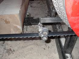 The boring task of sharpening a bandsaw blade. Modifications And Tricks With Small Bandsaw Mills
