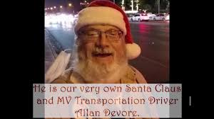 He has a long-white beard and is spreading holiday cheer