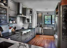 Solid wood cabinets add more value to your kitchen than the coolness of the gray countertops and european stainless steel range balance the yellow this rustic farmhouse kitchen from hgtv's fixer upper is loaded with charm. Farmhouse Kitchen White Oak Floors Subway Tile And Grey Cabinets Farmhouse Kitchen Dallas By Corker Designs Houzz