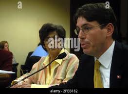 Rep. Stephen Bright, R-Maumelle, right, answers questions