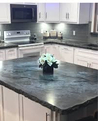 It has a stone and glass mixed mosaic tile backsplash with a travertine floor. Alabama Concrete Artisan Discovers The Ashby System Concrete Decor