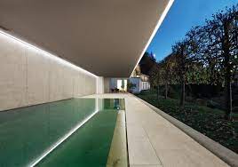 Recessed, linear luminaire with small profile using specially designed louver and optical system to control beam spread as well as glare. Hidden Lighting 5 Ways To Delicately Light A Building Archdaily