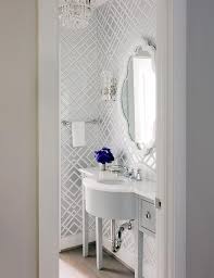 Update your powder room wallpaper with these 16 ideas for a whole new fresh look. White And Gray Powder Room With Gray Wainscoting And Gray Leaf Wallpaper Transitional Bathroom