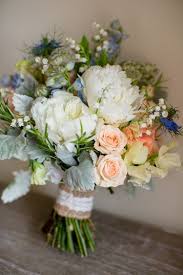 True blue flowers are natural rarities, and their color secrets aren't readily shared. Flowers Bouquet Peonies Roses Peach Blue Green Summer Bride Bridal Natural Soft Stylish Luxe Wedding Blue Wedding Bouquet Wedding Bouquets Hand Bouquet Wedding