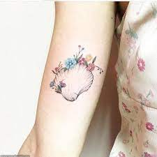 Shell And Flowers Shell Tattoos Seashell Tattoos Tattoos