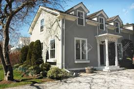 This is how i replace rotted trim on a stucco house in such a way to give a long lasting result. Green Stucco House With Pillars By Front Entrance And White Trim Stock Photo Picture And Royalty Free Image Image 447069