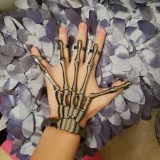 After this, draw a lightning shape next to that and then draw teeth on the bottom of it. Skeleton Hand Bracelet Hot Topic