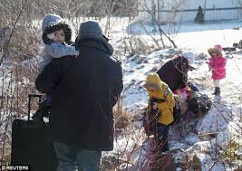 Illegal immigrants flood to Canada amid deportation threat