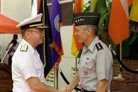 After assuming command of DCINC, Rear Admiral Walter S. Doran is welcomed  aboard by CINC, U.S. Southern Command, General Wesley K. Clark