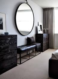 Identical round mirrors above the bed. Oversized Round Mirror In A Bedroom Celebrate Decorate
