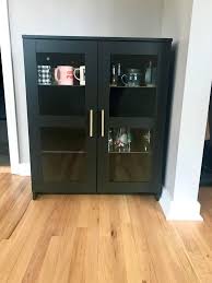 Ikea kitchen design with ikea cabinets with ikea lindingo doors accented with ikea tyda handles paired with black countertops and gray subway tile a white wood panel refrigerator fitted with brass handles is positioned in a white kitchen boasting white shaker cabinets adorned with brass pulls. Adding Gold Handles To My Brimnes Was A Game Changer Ikea