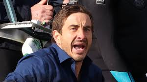 Ryan Corr braves the winter chill to shoot scenes with a prosthetic dolphin  at Bondi Beach as he continues to film new movie Kangaroo