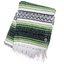 Round mexican serape blanket material with a pom pom fringe. Queretaro Orizaba Original
