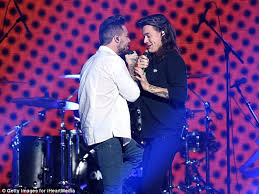 One Directions Harry Styles And Liam Payne Sing At Kiis
