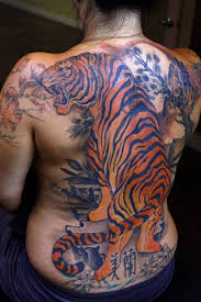These powerful creatures are solitary hunters and are usually depicted with teeth bared in aggressive postures often surrounded by bamboo. Blind Tiger Tattoo