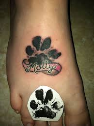 Dog paw print tattoo with flowers. Black Paw Print And Banner Tattoos On Foot Pawprint Tattoo Tattoos Paw Tattoo