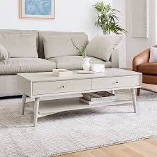 Round tables are easy to move around while square tables pair well with sectionals. Mid Century Storage Coffee Table