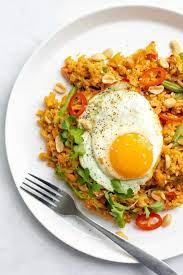 Add in mushrooms and leafy parts of the asian greens and stir fry for another minute until mushrooms are browned. Brown Rice Nasi Goreng Indonesian Fried Rice I Georgie Eats