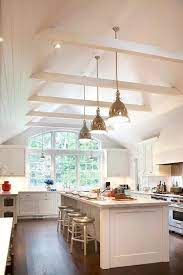 Subway tile over the range hood blends it into the backsplash design. Pin On Exposed Beams Ceiling Lighting