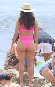Eva Longoria shows off her toned figure in a plunging hot pink swimsuit  while enjoying family time on the beach in Spain | Daily Mail Online