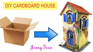 A cardboard house with a lotus pod roof on a natural wood slice, colorful tissue paper, embellishments including a. Diy Sunflower Fairy House Youtube