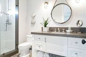 Create An Illuminated And Elegant Bathroom With The Right Features Round Mirror Bathroom Mirror Wall Bathroom Elegant Bathroom