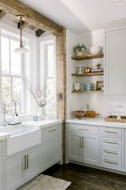 The various shades, from charcoal grey to light grey, are excellent. White Grey Kitchen A Timeless Tranquil Tour Hello Lovely